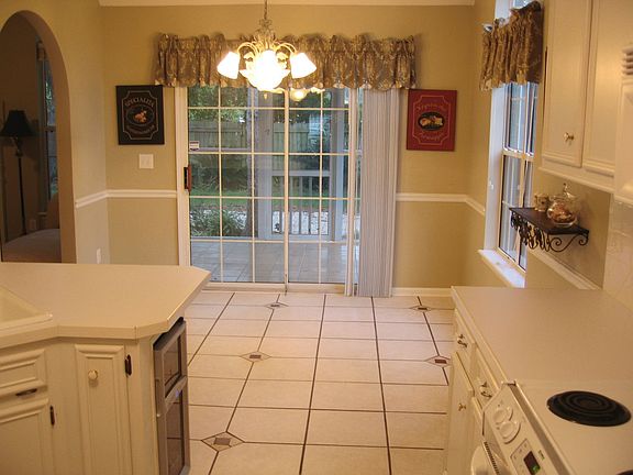 tiled kitchen with connected porch