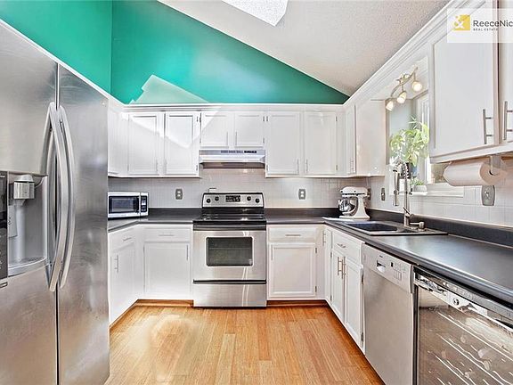 Wonderful kitchen complete with stainless steel appliances and wine fridge!