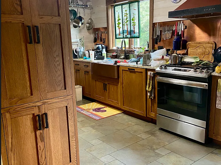 View of kitchen from opening to living room