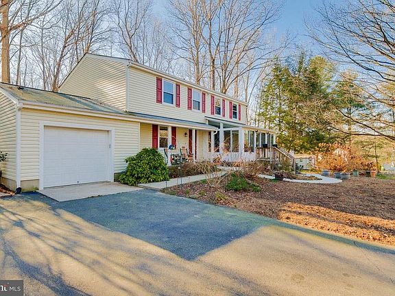 Front has circular driveway and carport, not shown