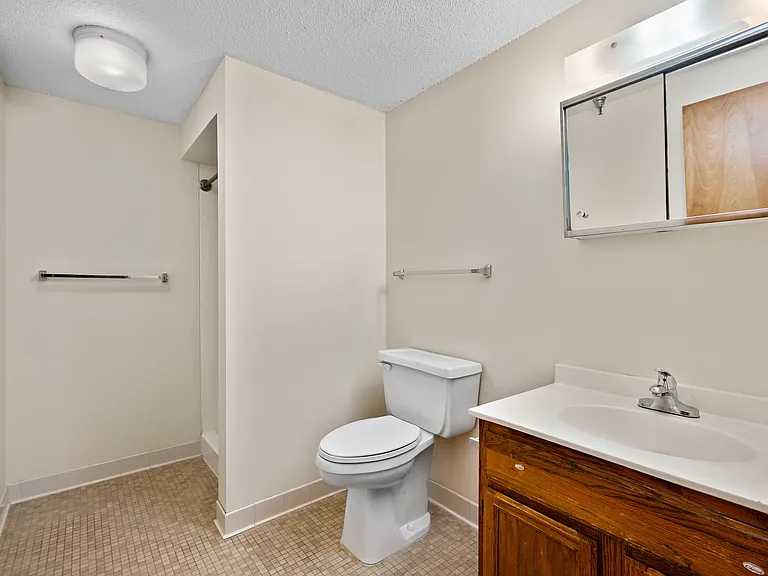 Welcome to Chardon Court Apartments, where modern comfort meets functional design. This spacious bathroom offers a clean aesthetic with stylish fixtures and ample storage. Schedule a visit today to see all that Chardon Court has to offer!