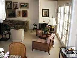 Living room opens to pool