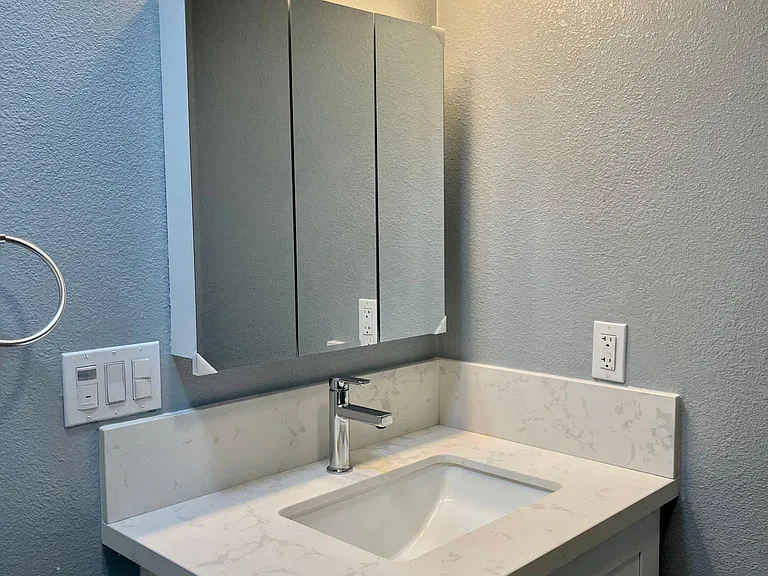 Large bathroom with a beautiful vanity and ample storage!