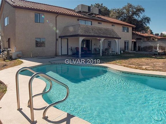 Cool Decking around pool and spa adjacent to covered patio