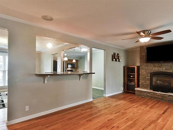 Upon entering the home one is struck by the fabulous open floor plan that the current owner created by opening the living room, dining room and kitchen to each other