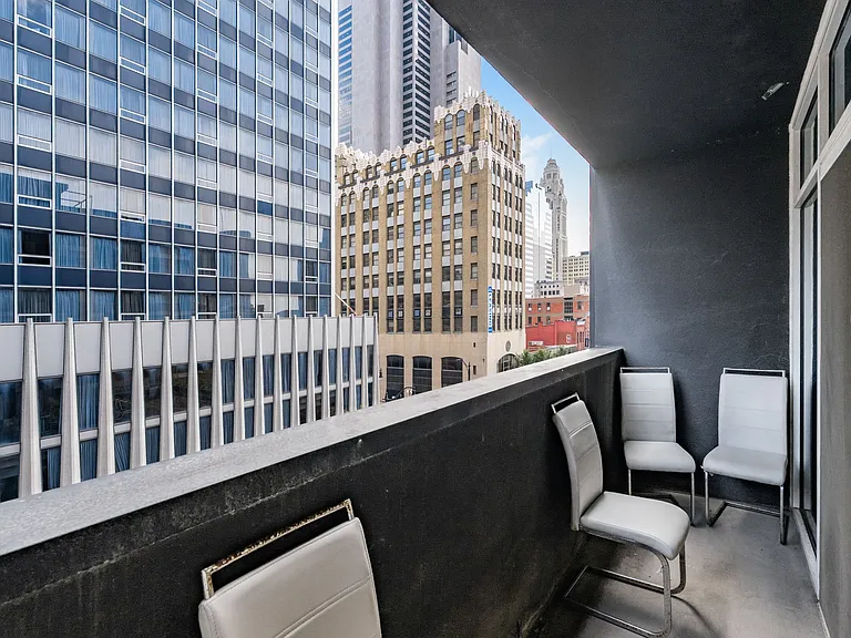Large balcony with city views.