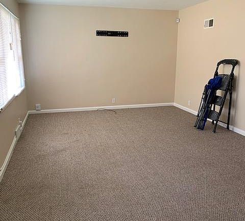 Living room with fresh paint and carpet