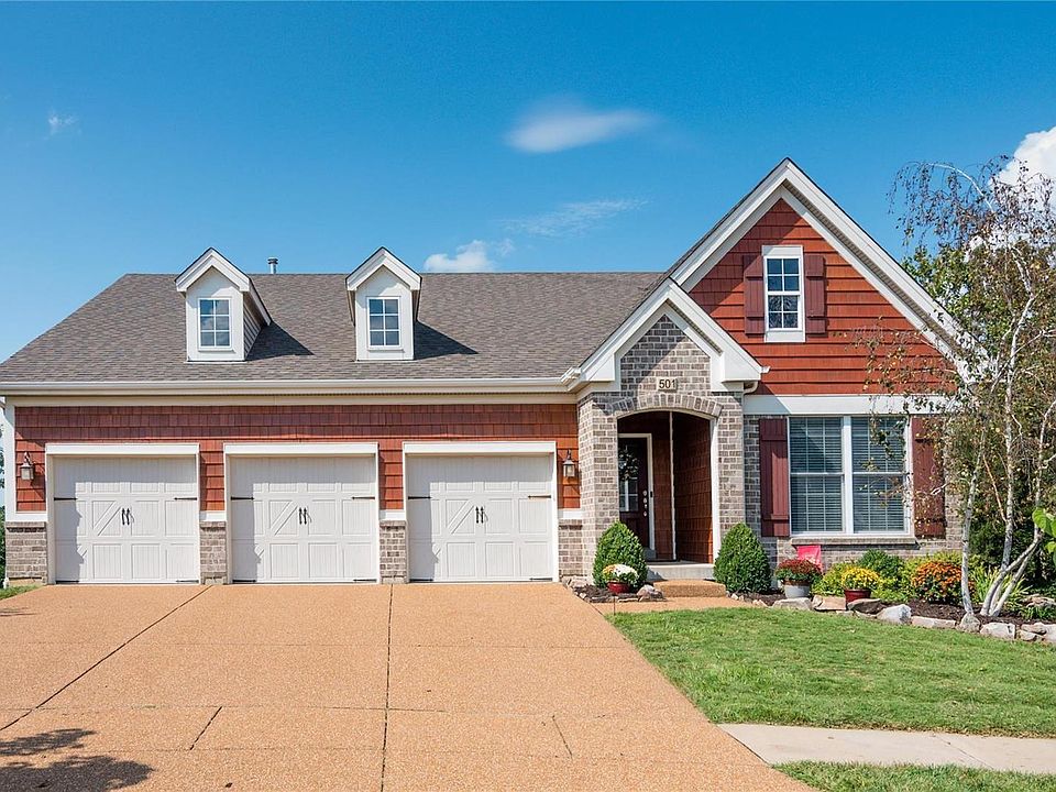 Great curb appeal! Note the aggregate stone driveway.