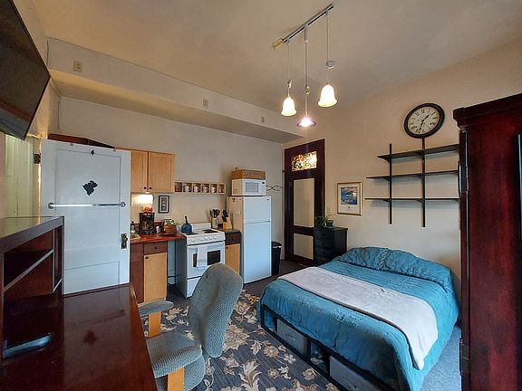 Desk and full-size bed
