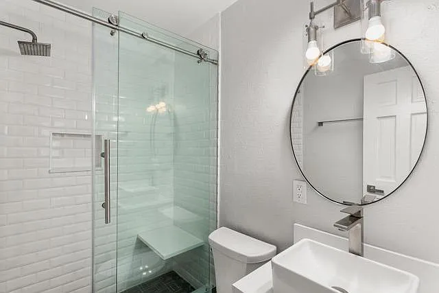 Walk in shower. Medicine cabinet above toilet (not shown).
New vanity and sink.