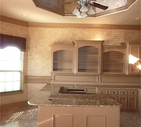 Study - 17x13 with natural light from windows in turreted ceiling, bay window, granite desk-tops, walls of built ins.