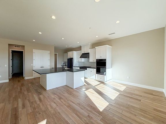 Casual Dining adjacent to kitchen with a patio door for easy access to outdoor living space