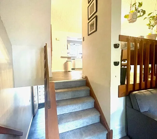 Interior staircase connecting the entryway and main living level.