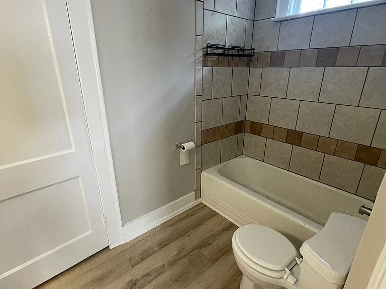 Bathroom with shower/bath tolet vanity and sink