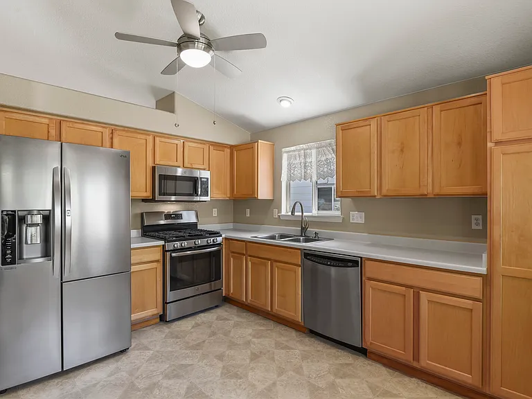 Appliances including a gas stove, refrigerator, gas range, microwave and dishwasher