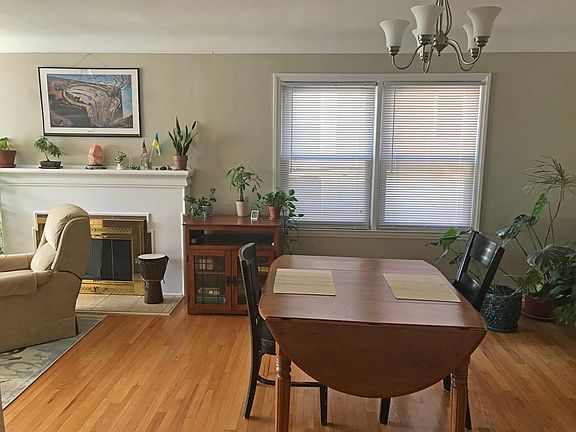 Dining area. Lights have a dimmer switch. Usable natural fireplace.