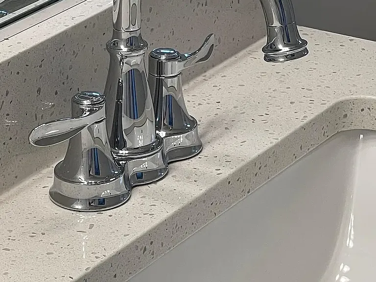 Quartz bathroom vanities in both full baths