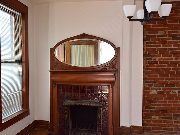 Fireplace in Living Room with updated light fixture