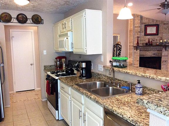 Open kitchen to family room. Updated lighting!