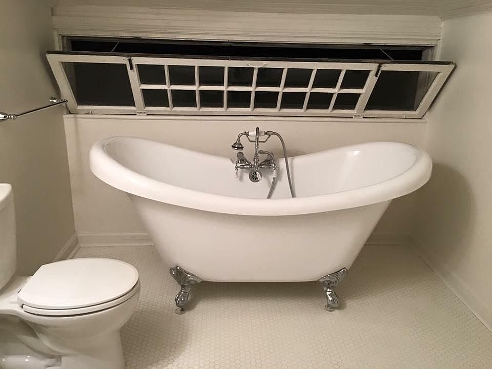 Relax in the beautiful clawfoot soaking tub located in the upstairs bathroom. (Room is now painted a blue/gray.)