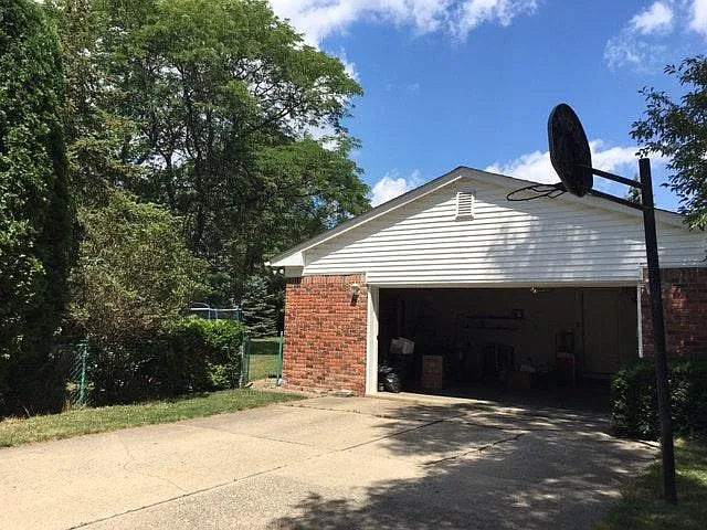 drive way to garage (left) and front yard (right)
