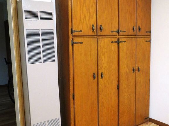 Main Floor built in cabinets & wall furnace