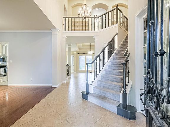 The Entryway invites you to a Grand Staircase with a Private Study to the right and Formal Dining Room to the left.