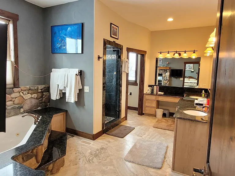 Spacious Master Bath, Make Up Counter, Sunken Jetted Tub, Steamer Shower, Dual Shower Heads.