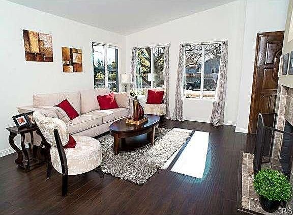 The living room with views out to the front yard.