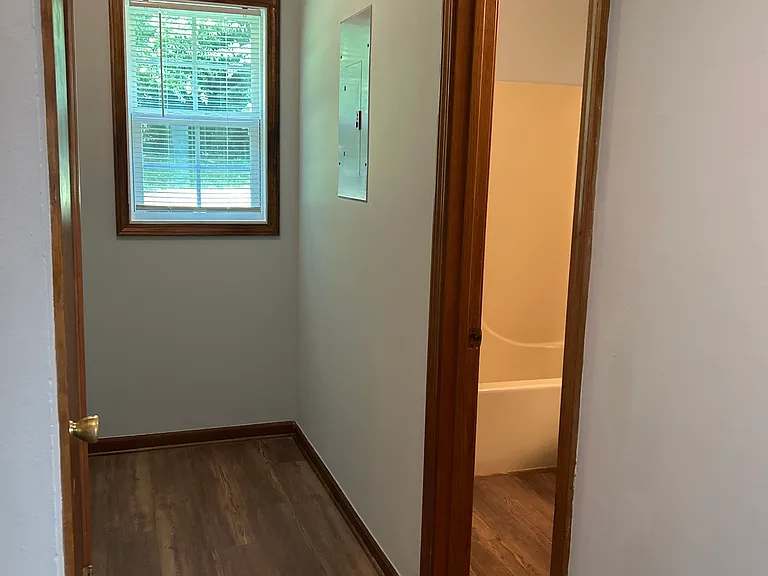 Hall leading to laundry area, hall bath and 2 closets