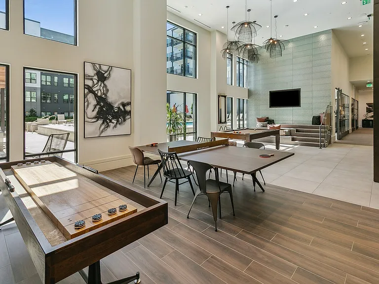 Hang out, play games, or catch the game in this bright and stylish clubroom made for connection and fun.
