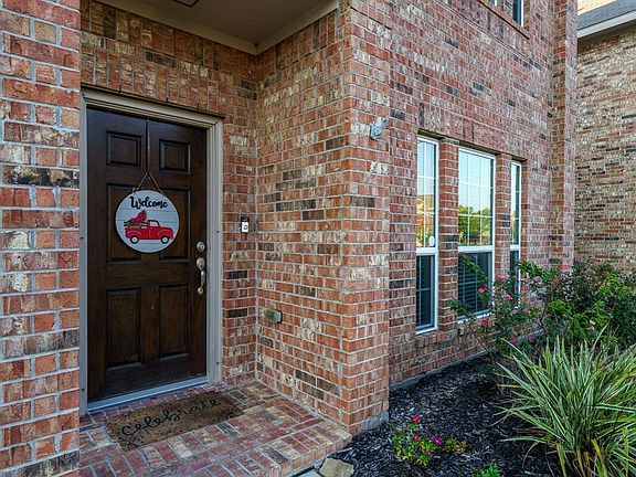 Welcome home to your all brick front facade and covered front porch.