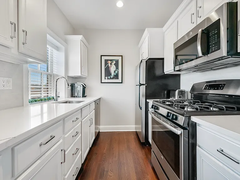 Newer Kitchen with Quartz Countertops Fully Accessorized with all your Cooking Needs
