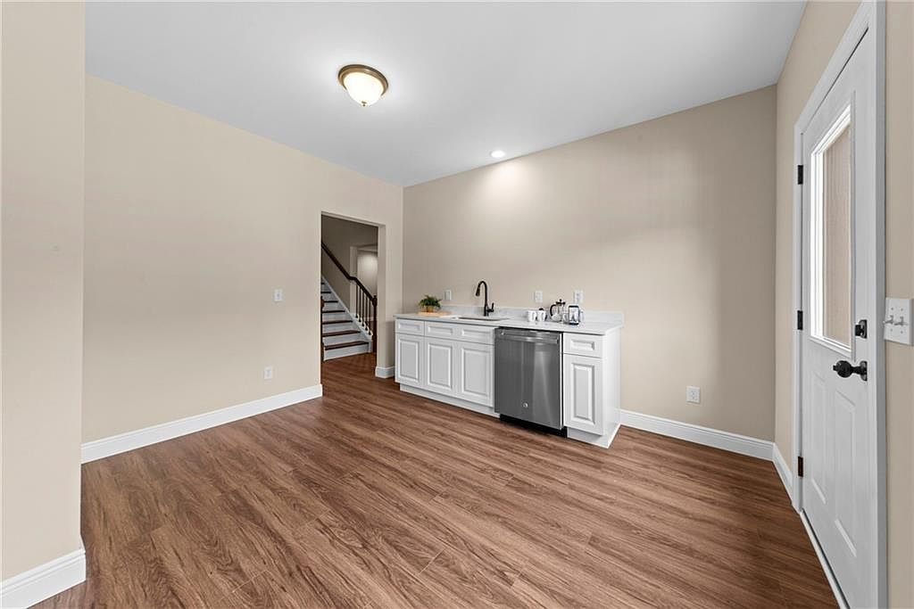 Finished daylight basement with kitchenette and exterior entry