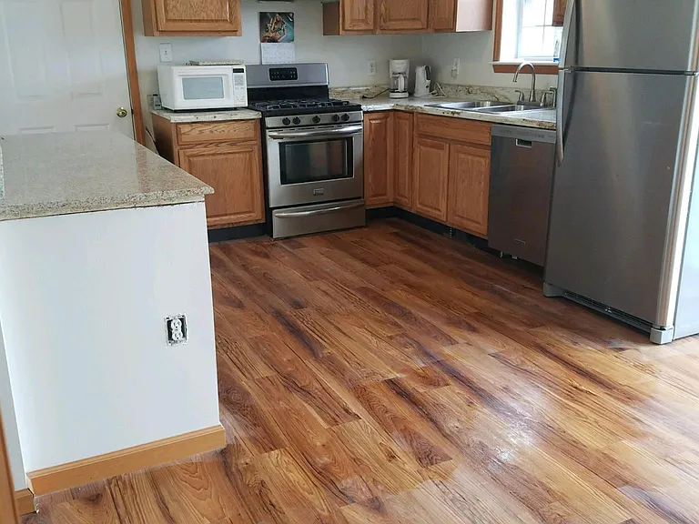 Updated , Beautiful Kitchen with Granite Countertop Island and stainless Steel appliances !!