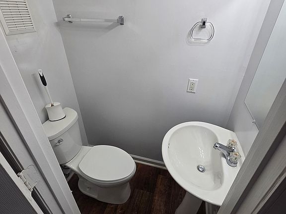 Downstairs half bath off of living room.