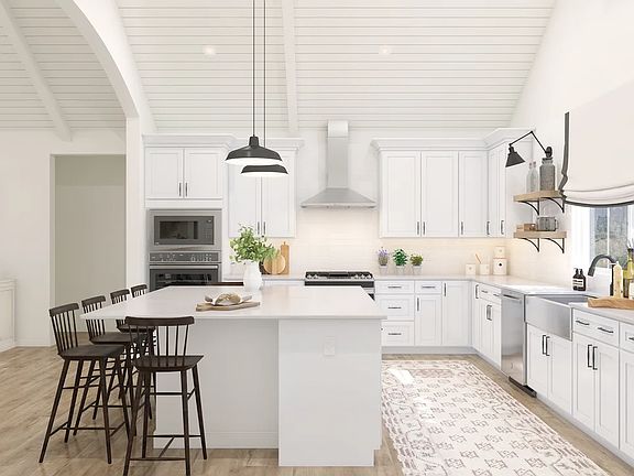 Kitchen with white cabinetry floating shelves
