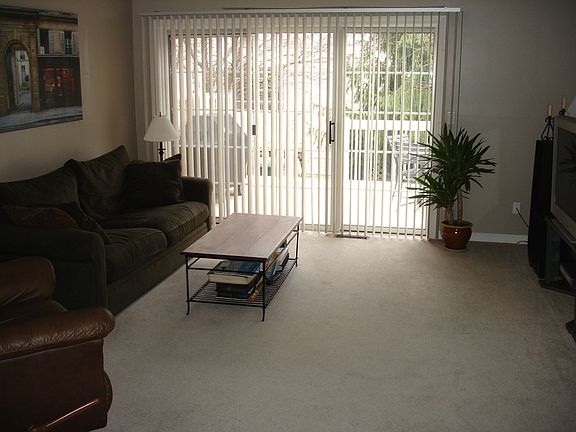 The family room is nice & bright with the glass double doors leading to deck.