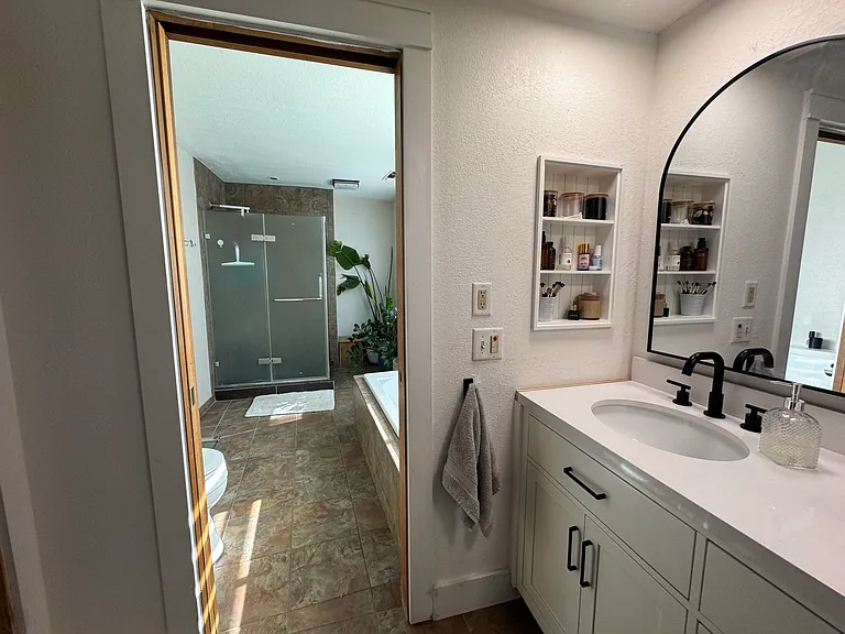 master bathroom with full tub and shower