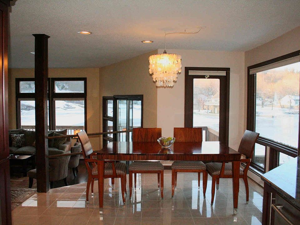 The kitchen opens to a bright dining area and spacious living room.