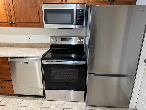 Brand new stainless steel appliances in kitchen