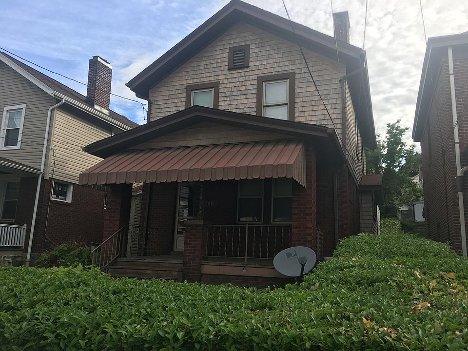 Street front view with beautiful front porch. 