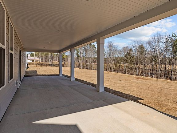 Norris Design expansive rear covered porch. At Lakeside Glen by premier builder DRB Homes in York, S