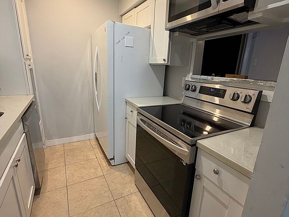 Renovated kitchen with dishwasher and ample cabinet space