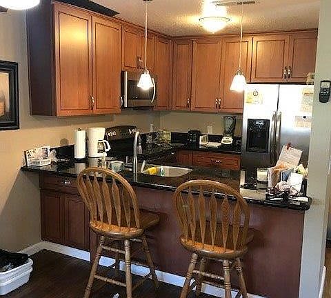 A beautiful kitchen with stainless steel appliances the refrigerator is included...