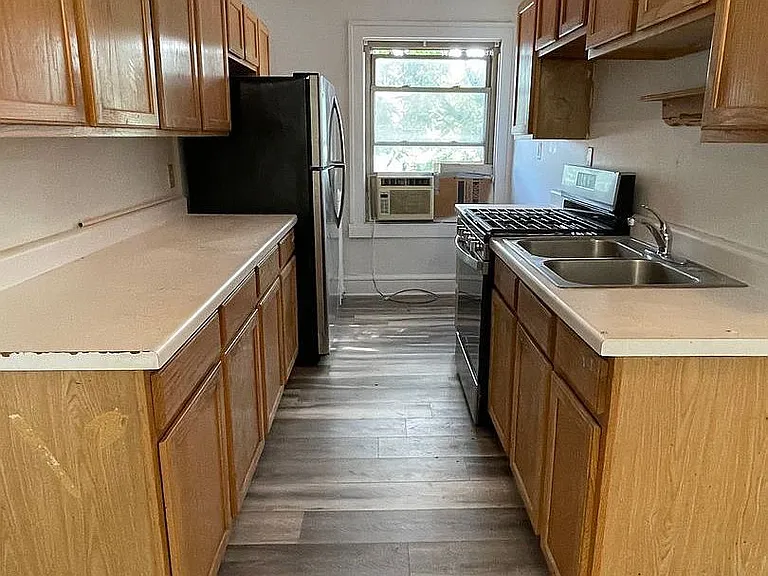 Discover modern living at LS Capital Group with this updated kitchen featuring sleek appliances and ample cabinet space. The inviting layout is perfect for culinary adventures. Schedule your tour today to see your future home!