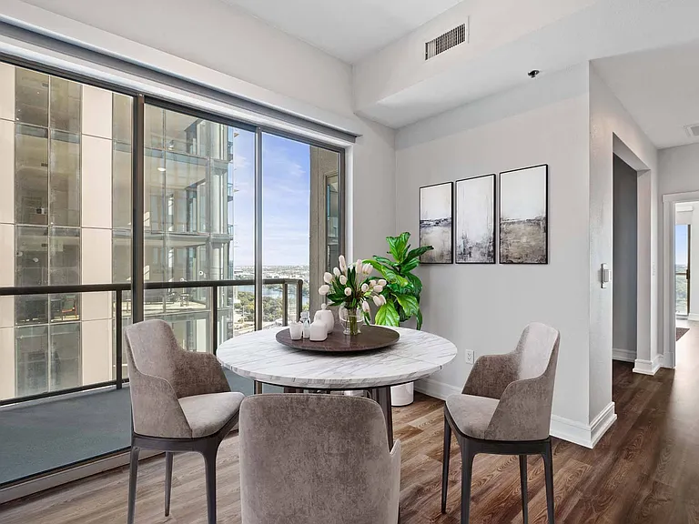 Gather, unwind, and take in the view from your balcony-side dining space.