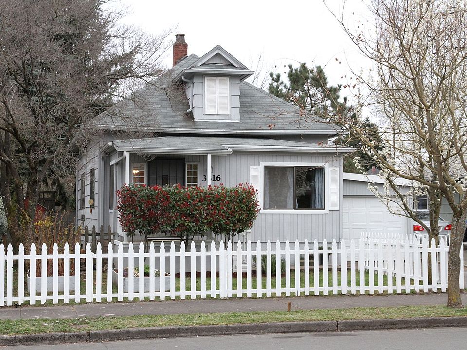 Cute home with white picket fence