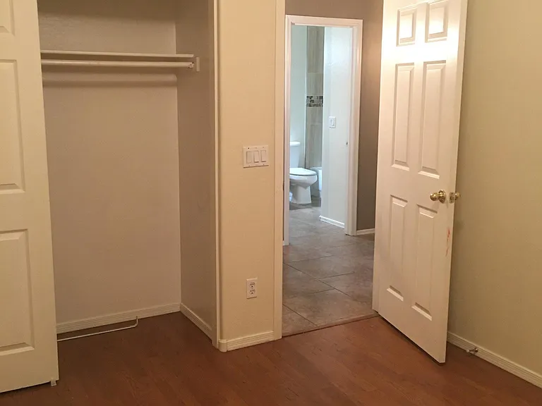 Guest bedroom #2 with laminate flooring.