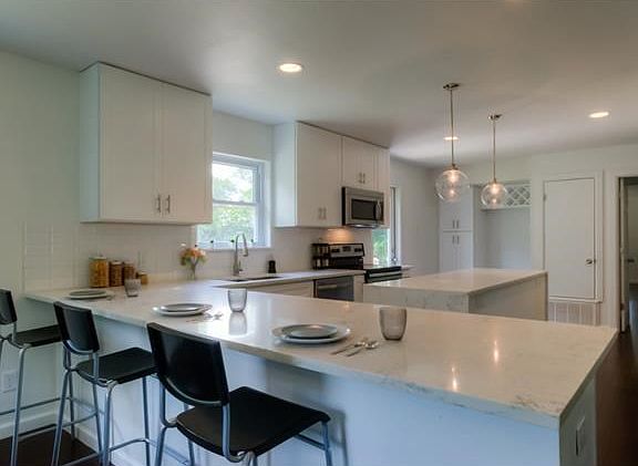 Another angel of this oversized space. Note the wine rack and storage next to refrigerator space.